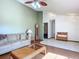 Living room with hardwood floors, a sofa, and a view into another room at 2810 Summerfield St, Deltona, FL 32738