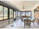 Relaxing screened porch with patio furniture and ceiling fan at 2810 Summerfield St, Deltona, FL 32738