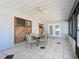 Bright screened porch with glass doors and wood accent wall at 2810 Summerfield St, Deltona, FL 32738