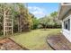 Large backyard with mature trees and grassy area at 3431 Wilder Ln, Orlando, FL 32804
