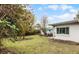 Spacious backyard with patio and partial home view at 3431 Wilder Ln, Orlando, FL 32804
