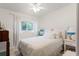 Cozy bedroom with ceiling fan and window providing natural light at 3431 Wilder Ln, Orlando, FL 32804