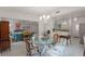 Open dining room with a chandelier and access to the kitchen at 3431 Wilder Ln, Orlando, FL 32804