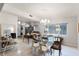 Dining area with glass table, chairs, and views into kitchen at 3431 Wilder Ln, Orlando, FL 32804