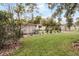 Landscaped front yard with mature trees and drought-tolerant plants at 3431 Wilder Ln, Orlando, FL 32804