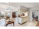 Open concept kitchen with breakfast nook and view into living room at 3431 Wilder Ln, Orlando, FL 32804
