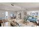 Open living area with seating, dining areas, and access to kitchen at 3431 Wilder Ln, Orlando, FL 32804