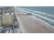 Aerial view of beachfront property with pier and ocean at 3724 S Atlantic Ave # 20, Daytona Beach, FL 32118
