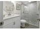 Bathroom with white vanity, marble shower and mosaic floor at 3724 S Atlantic Ave # 20, Daytona Beach, FL 32118