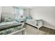 Twin bedroom with two beds, nightstand and ocean decor at 3724 S Atlantic Ave # 20, Daytona Beach, FL 32118