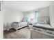 Twin bedroom with two beds, nightstand and ocean decor at 3724 S Atlantic Ave # 20, Daytona Beach, FL 32118