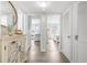 Hallway with access to bedrooms and updated flooring at 3724 S Atlantic Ave # 20, Daytona Beach, FL 32118