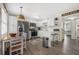 Modern kitchen with white cabinets, stainless steel appliances, and breakfast bar at 3724 S Atlantic Ave # 20, Daytona Beach, FL 32118