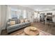 Open living area with gray couch, coffee table, and adjacent kitchen at 3724 S Atlantic Ave # 20, Daytona Beach, FL 32118
