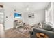 Living room with gray couch, coffee table, and ocean-themed decor at 3724 S Atlantic Ave # 20, Daytona Beach, FL 32118