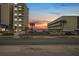 Oceanfront view at sunset, building and parking visible at 3724 S Atlantic Ave # 20, Daytona Beach, FL 32118