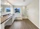 Bathroom with soaking tub, walk-in shower, and granite vanity at 4047 Sw 51St Ct, Ocala, FL 34474