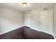 Spacious bedroom featuring dark hardwood floors and ample closet space at 4047 Sw 51St Ct, Ocala, FL 34474