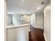 Bright hallway with dark hardwood floors and recessed lighting at 4047 Sw 51St Ct, Ocala, FL 34474