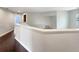 Upstairs hallway with dark hardwood floors and white walls at 4047 Sw 51St Ct, Ocala, FL 34474