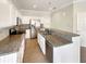 Modern kitchen with granite countertops and stainless steel appliances at 4047 Sw 51St Ct, Ocala, FL 34474