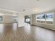 Spacious living area with wood-look tile floors and an open floor plan at 4047 Sw 51St Ct, Ocala, FL 34474