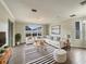 Bright living room featuring a sectional sofa, coffee table, and stylish rug at 4047 Sw 51St Ct, Ocala, FL 34474