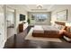 Spacious main bedroom with a king-size bed and ensuite bathroom at 4047 Sw 51St Ct, Ocala, FL 34474