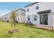 A backyard area with an installed patio that leads to a small lawn at 4329 Switchgrass Ln, St Cloud, FL 34772