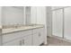Modern bathroom features double vanity, granite countertops, and a glass-enclosed shower at 4329 Switchgrass Ln, St Cloud, FL 34772