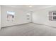 Spacious bedroom with multiple windows and neutral carpet at 4329 Switchgrass Ln, St Cloud, FL 34772