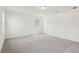 Bright bedroom features neutral carpet, a ceiling light, and a closet at 4329 Switchgrass Ln, St Cloud, FL 34772