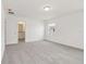 Large bedroom with neutral carpet, an ensuite bathroom, and a window at 4329 Switchgrass Ln, St Cloud, FL 34772