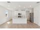 Bright kitchen featuring white cabinets, stainless steel appliances, and a center island at 4329 Switchgrass Ln, St Cloud, FL 34772