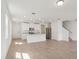 Bright, open-concept living space with tile floors, recessed lighting, and a kitchen view at 4329 Switchgrass Ln, St Cloud, FL 34772