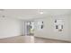 Spacious living room with tile flooring, slider to patio, and natural light at 4329 Switchgrass Ln, St Cloud, FL 34772