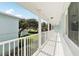 Covered balcony overlooking a backyard and neighborhood at 447 Seaview Ave, Daytona Beach, FL 32118