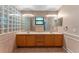 Main bathroom with double vanity and a glass block shower at 4938 Raylene Way, St Cloud, FL 34771