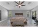 Bright bedroom with wood-look floors, sliding door to exterior at 4938 Raylene Way, St Cloud, FL 34771