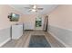 Bedroom with light pink walls, ceiling fan and wood-look floors at 4938 Raylene Way, St Cloud, FL 34771