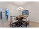 Casual dining area with wood table and light-colored chairs at 4938 Raylene Way, St Cloud, FL 34771