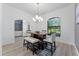 Dining room featuring a modern chandelier and natural light at 4938 Raylene Way, St Cloud, FL 34771
