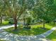 Landscaped yard with mature trees surrounds this charming house at 4938 Raylene Way, St Cloud, FL 34771