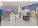 Modern kitchen with white cabinets and a large island at 4938 Raylene Way, St Cloud, FL 34771