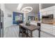 Eat-in kitchen with island, white cabinets and modern lighting at 4938 Raylene Way, St Cloud, FL 34771