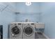 Bright laundry room with washer, dryer, and utility sink at 4938 Raylene Way, St Cloud, FL 34771