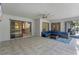 Spacious covered patio with tiled floor and sectional sofa at 4938 Raylene Way, St Cloud, FL 34771