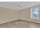 Bright bedroom featuring hardwood floors and large window at 526 Orange Dr # 37, Altamonte Springs, FL 32701