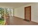 Condo entryway with brown door and small balcony at 526 Orange Dr # 37, Altamonte Springs, FL 32701