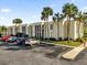 Condo building exterior with parking and palm trees at 526 Orange Dr # 37, Altamonte Springs, FL 32701